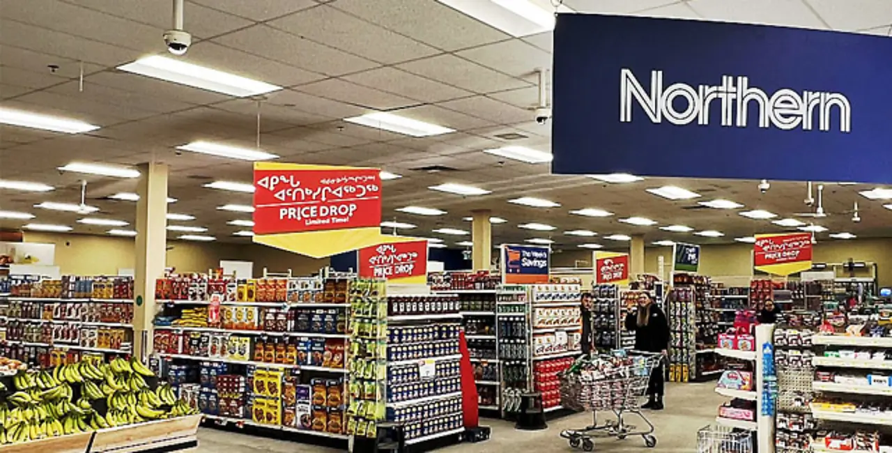 Inside a Northern store showing the aisles and a shopper with a full cart